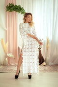 Crocheted long cotton dress decorated with tassels