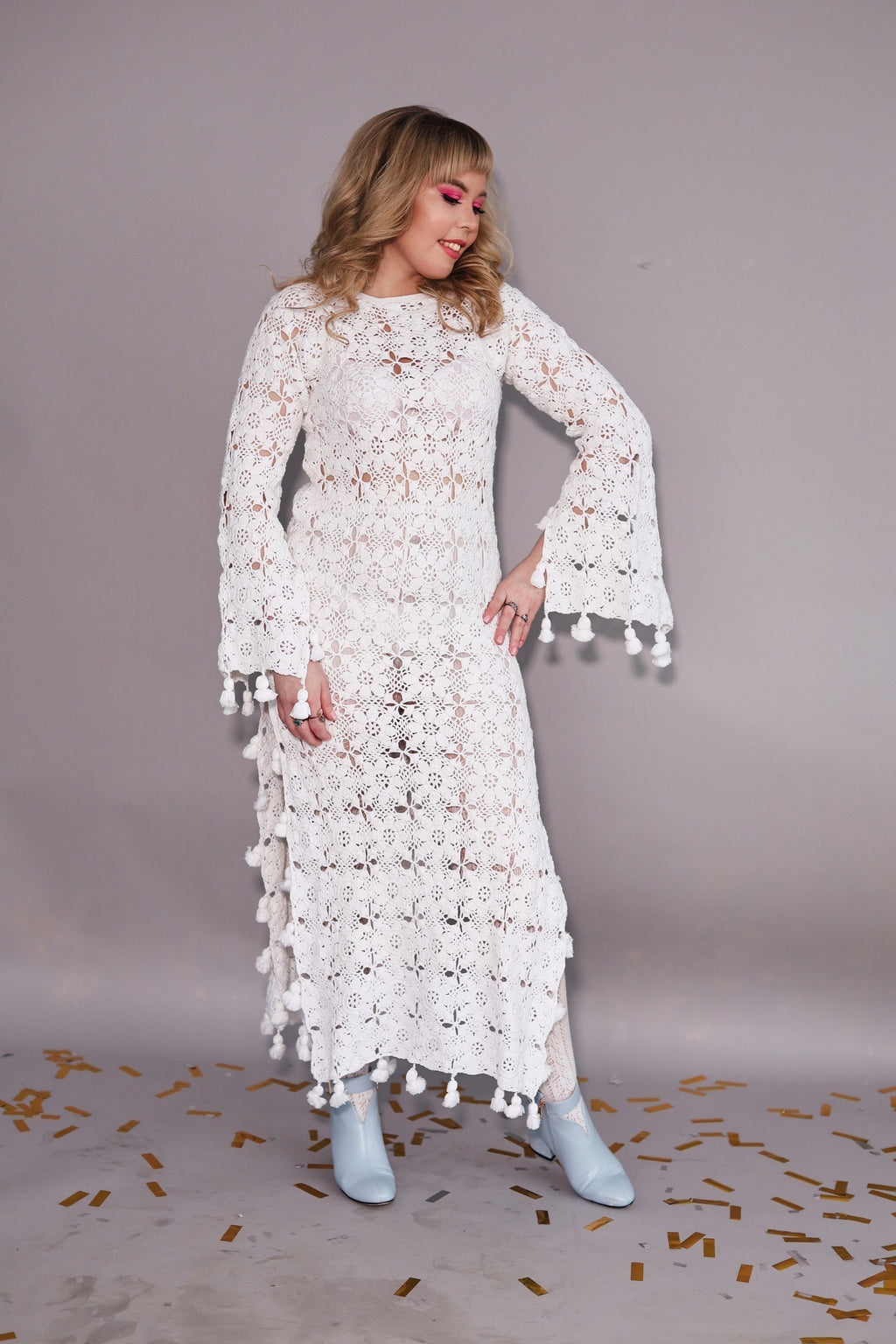 Crocheted long cotton dress decorated with tassels